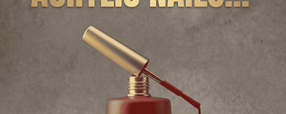 A close-up of colorful acrylic nails with artistic designs.