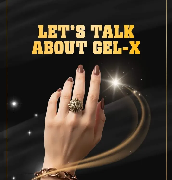 Hand with Gel-X nails, sun-themed ring, chunky bracelet, sparkly background.