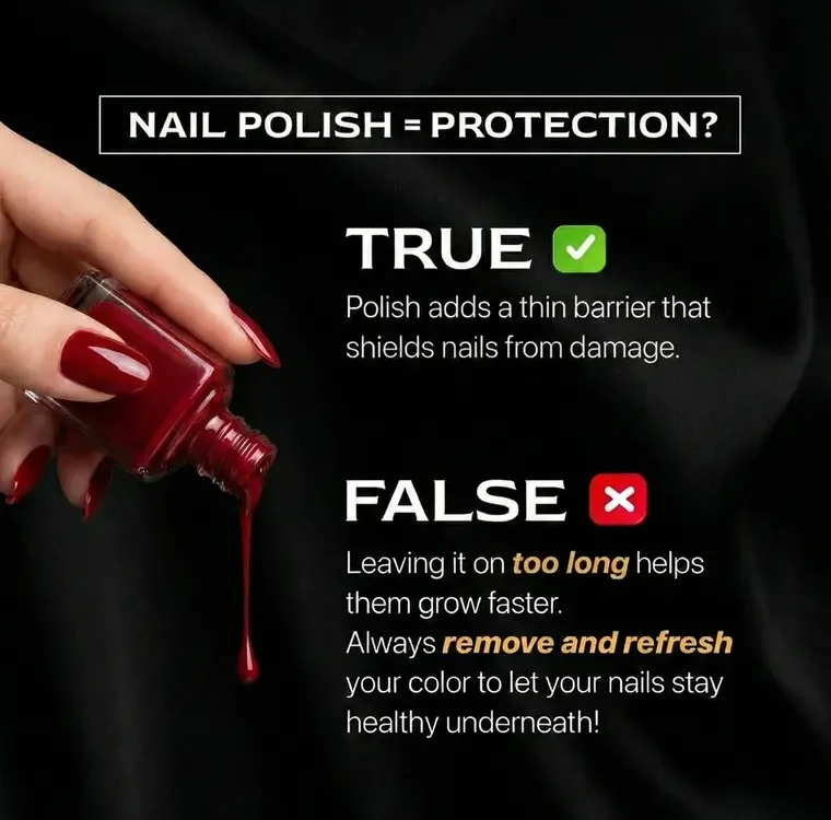 Hand holding a bottle of red nail polish, with polish dripping out.
